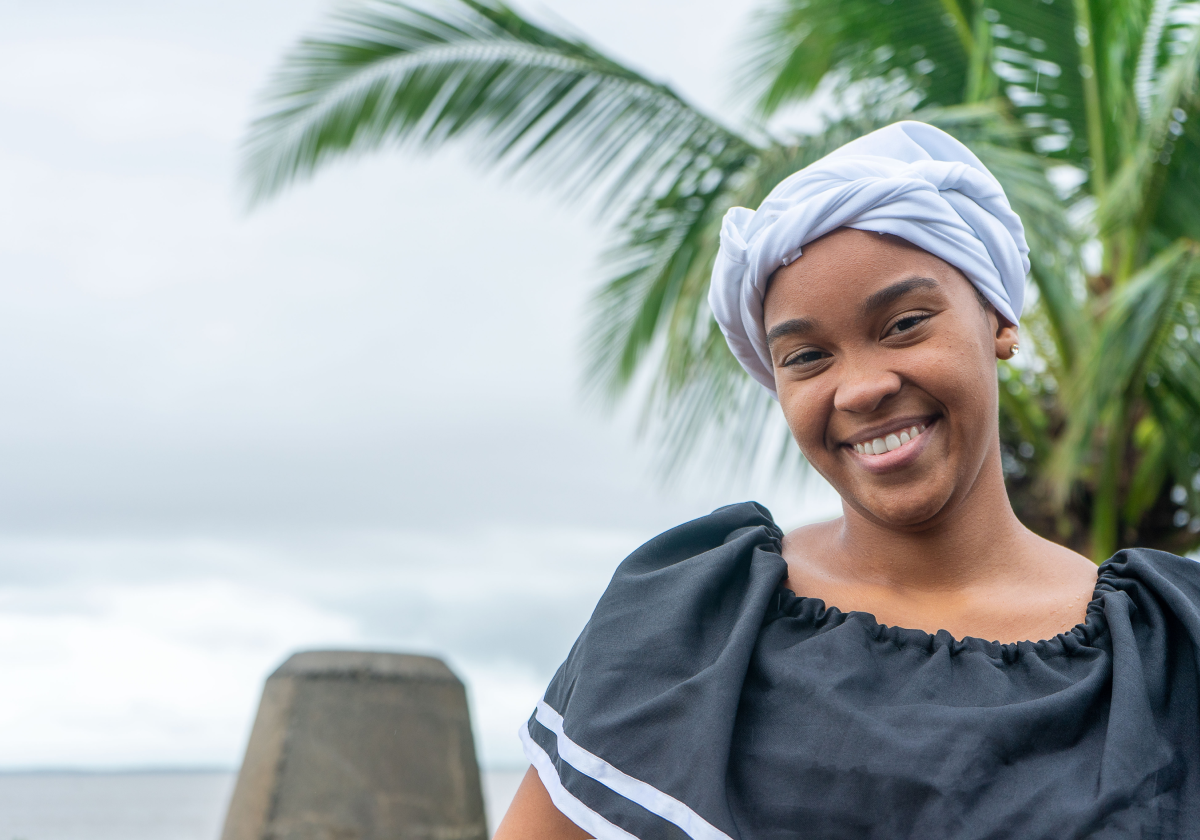 Woman smiling wearing traditional clothing in Dominica