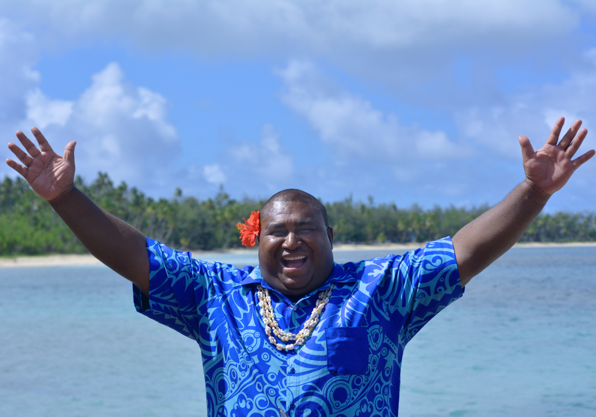 Man smiling on a beach in Saint Kitts and Nevis