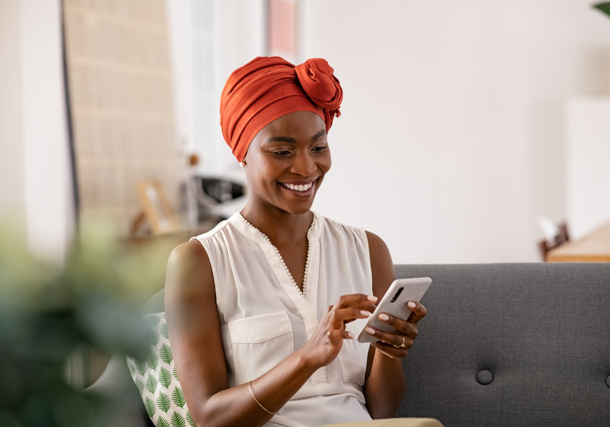Woman using mobile device in Guadeloupe