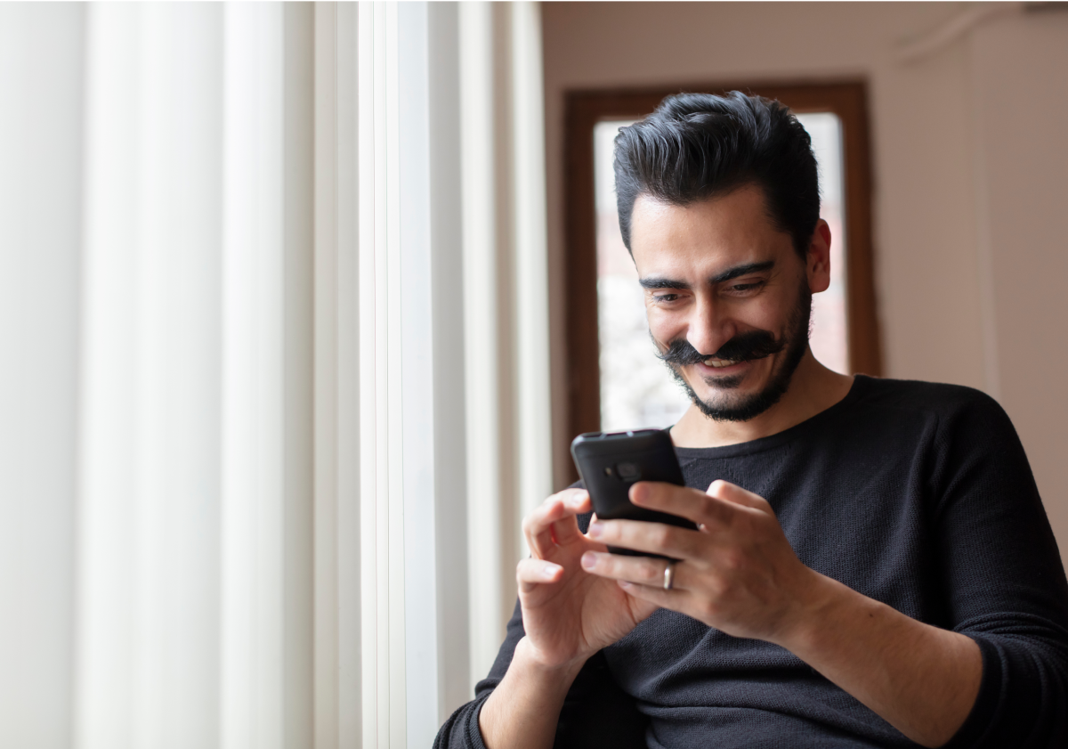 Photo of a man on his phone in Pakistan