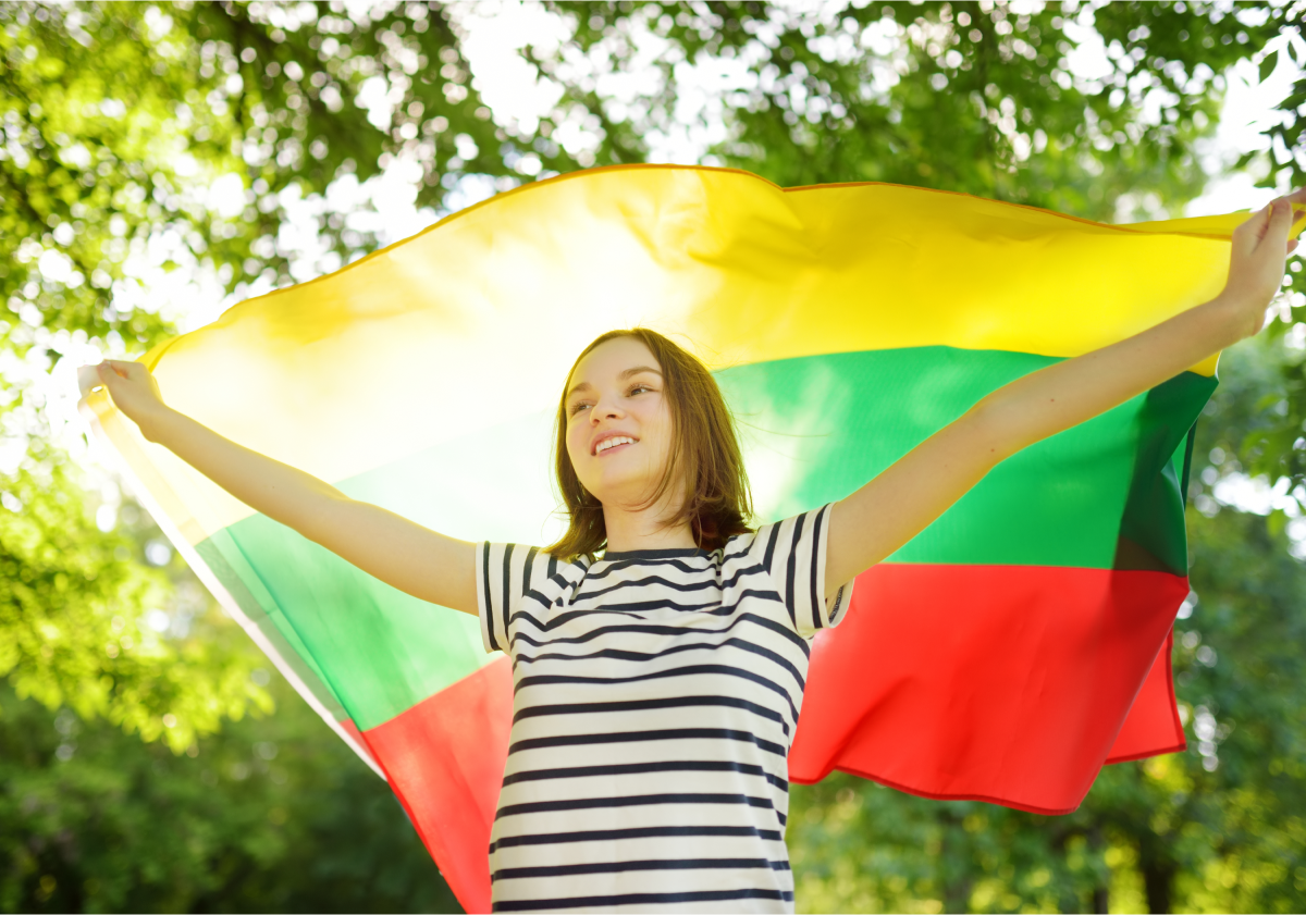 Photo of a woman holding a flag in Lithuania