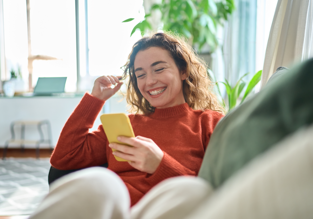 Woman holding cell phone in Estonia