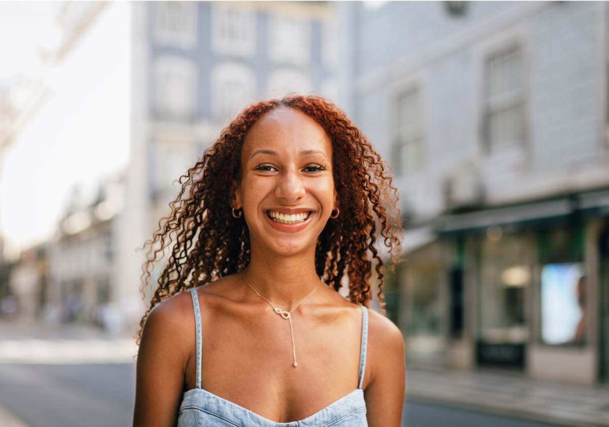Photo of smiling woman in a city in Portugal