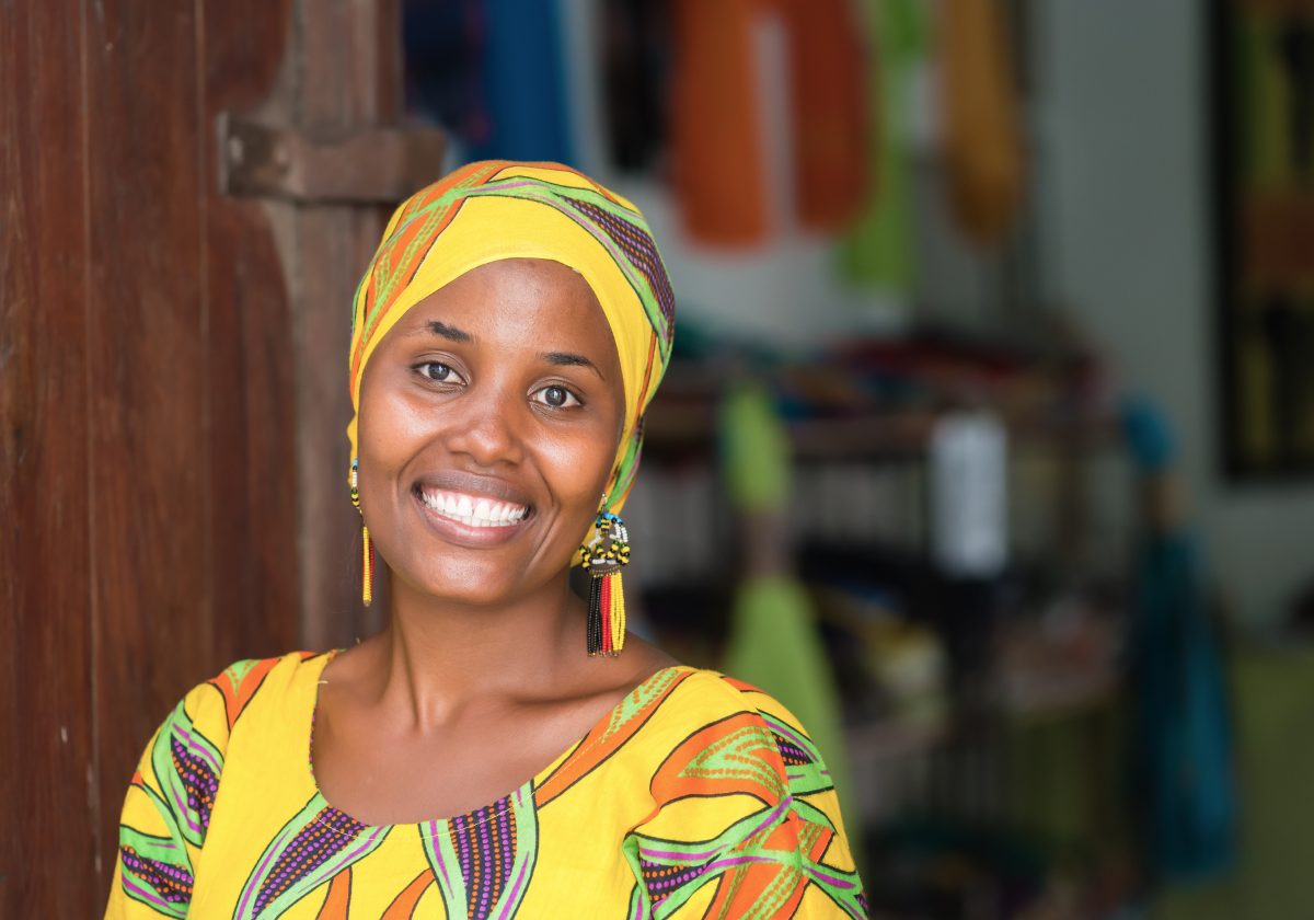 Woman in traditional clothing smiling in Tanzania