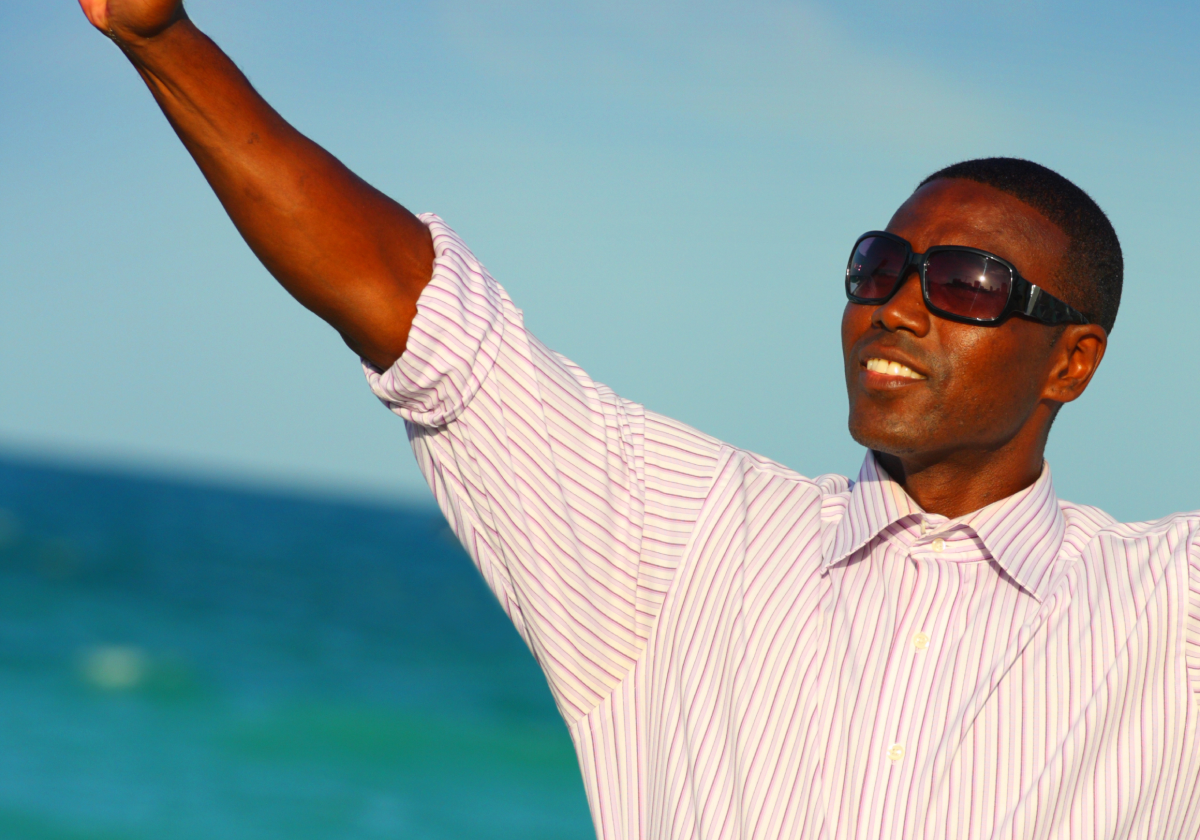 Man smiling on a beach in Saint Lucia