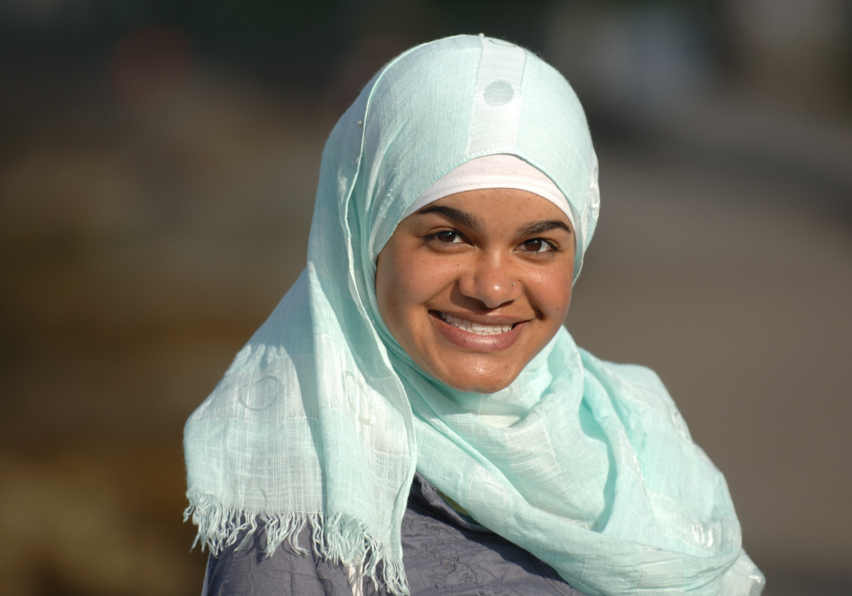 Woman smiling wearing traditional clothing in Iran