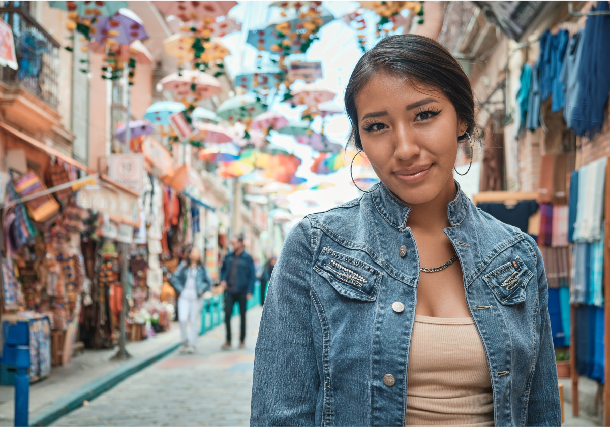 Photo of a woman standing in a city in Bolivia