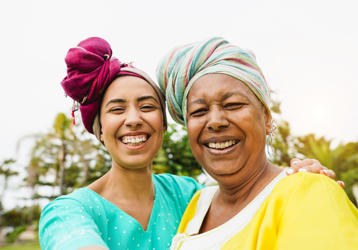 Two women smiling in traditional clothes in Cabo Verde