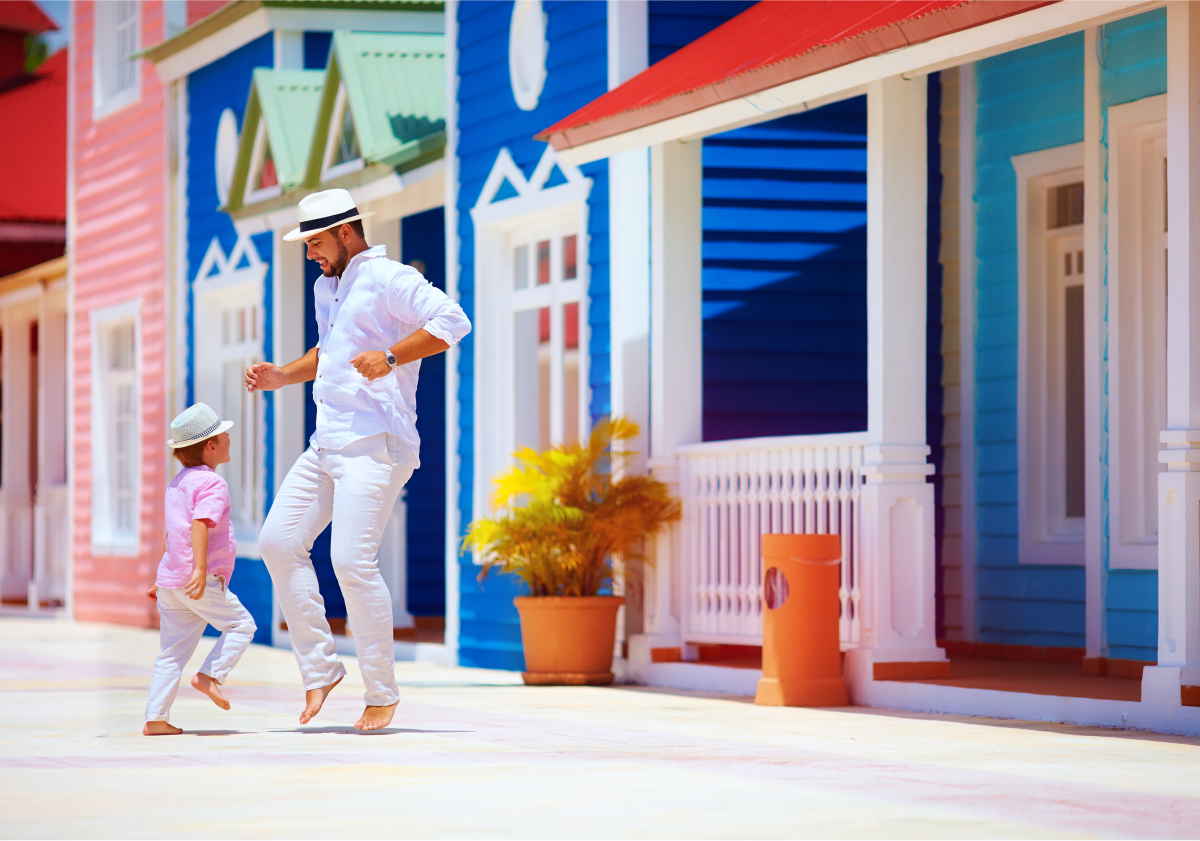 Photo of a father and son dancing on a street in the Dominican Republic