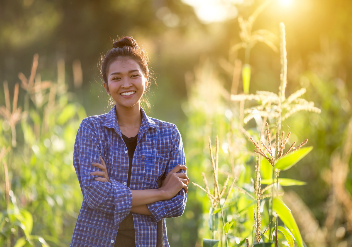 Woman smiling in a field in Laos