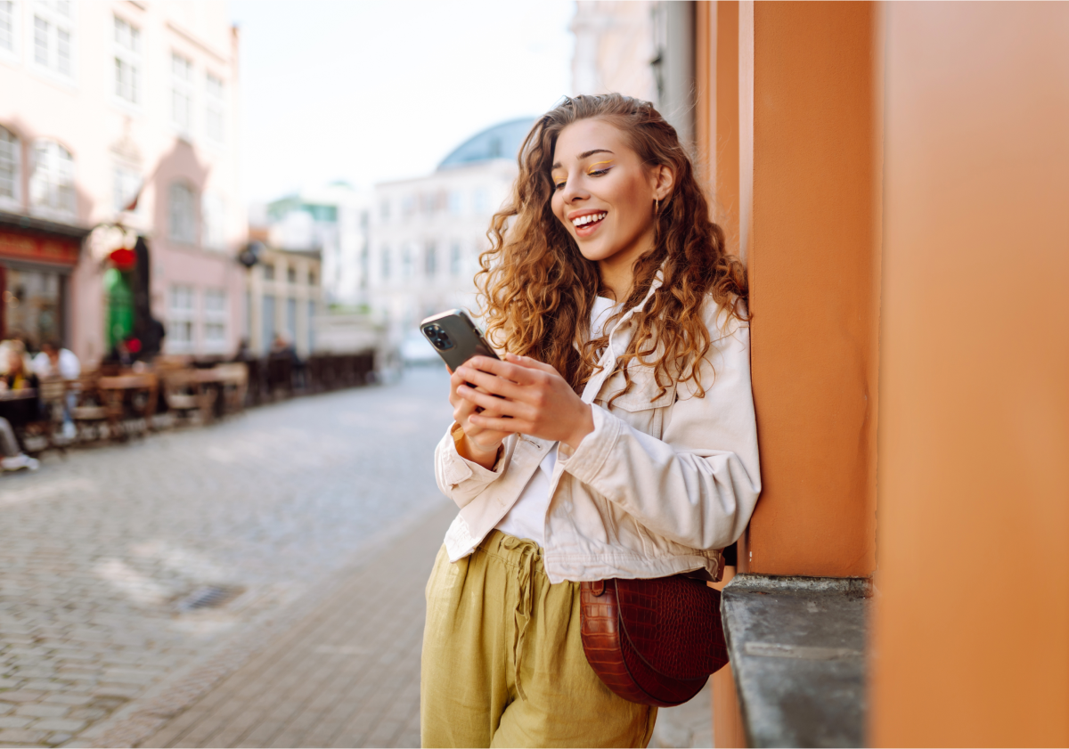 Woman using cell phone in France
