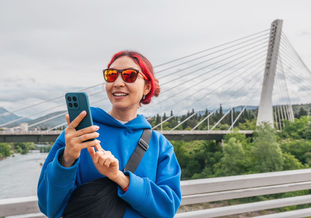 Woman on mobile phone in a city in Montenegro