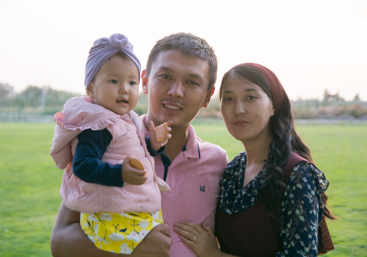 Family posing in a park in Kyrgyzstan